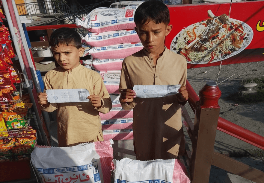 Orphans with ration bags